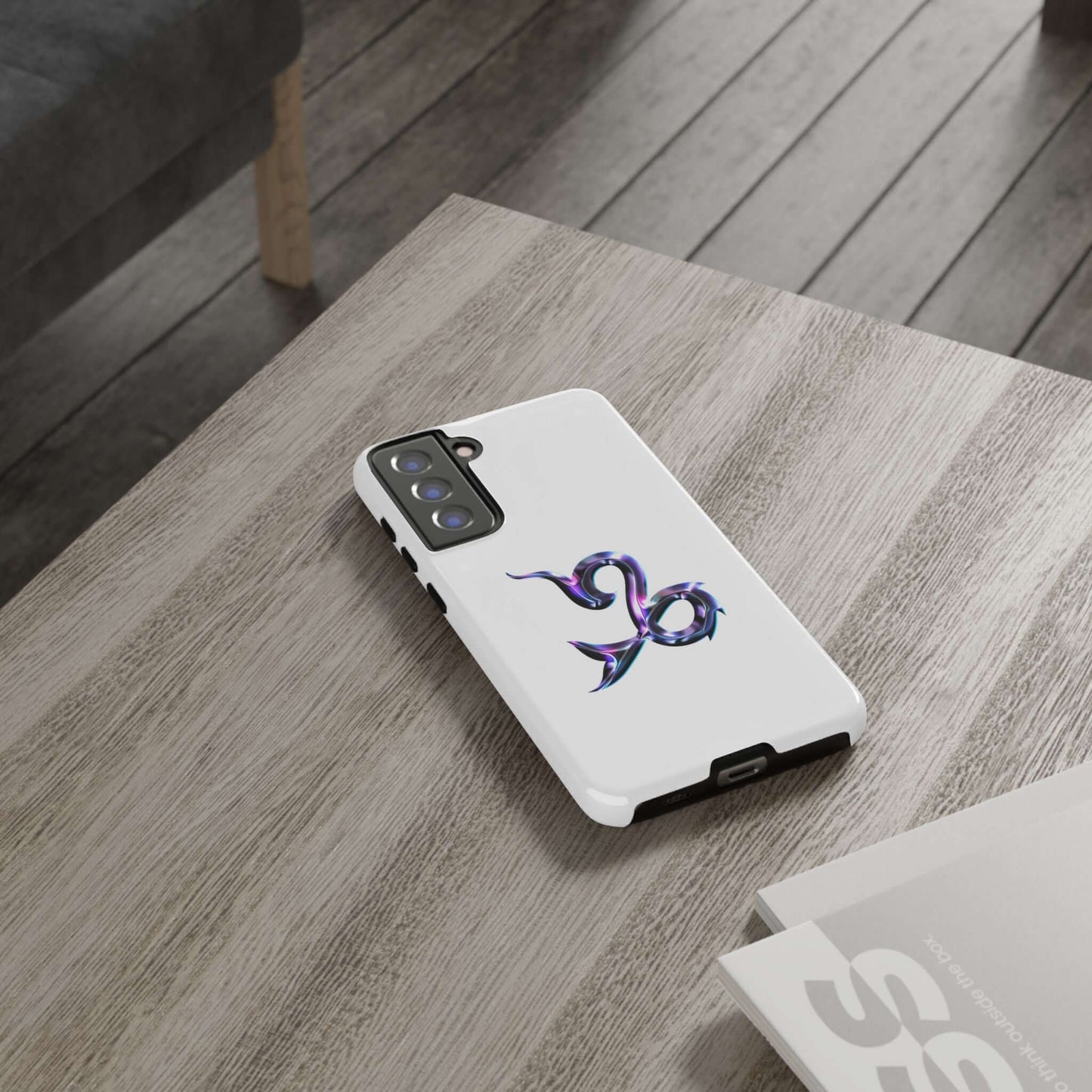 Personalized Zodiac phone case with colorful design resting on a wooden table, perfect for astrology enthusiasts.