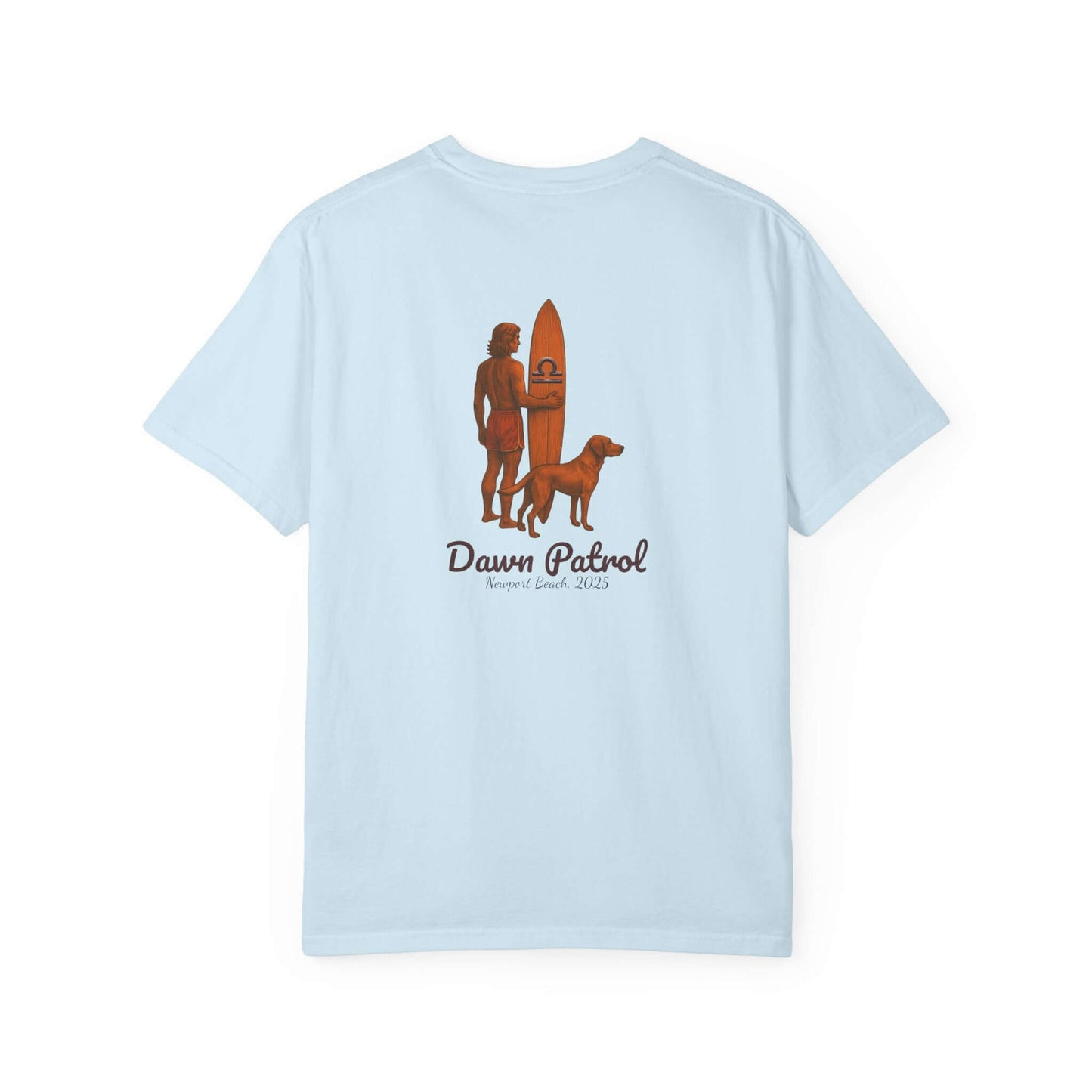 Back view of a light blue t-shirt featuring a surfer and dog graphic with 'Dawn Patrol' text.