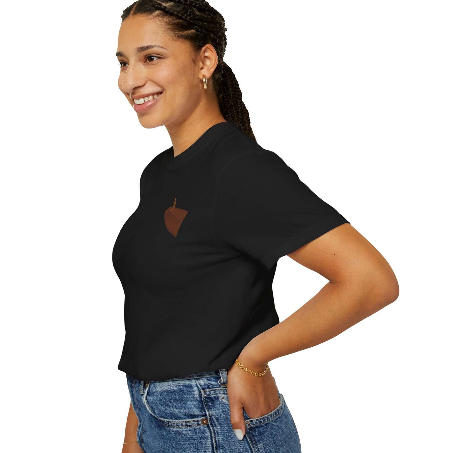 Smiling woman wearing a black personalized t-shirt with a simple design, showcasing laid-back summer style.
