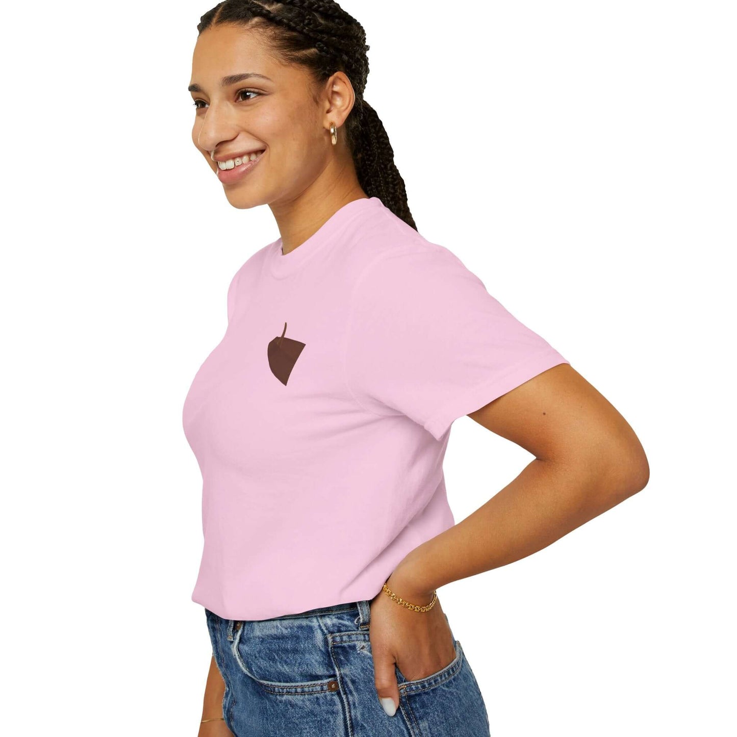 Smiling woman wearing a pink personalized t-shirt with a simple brown logo design.