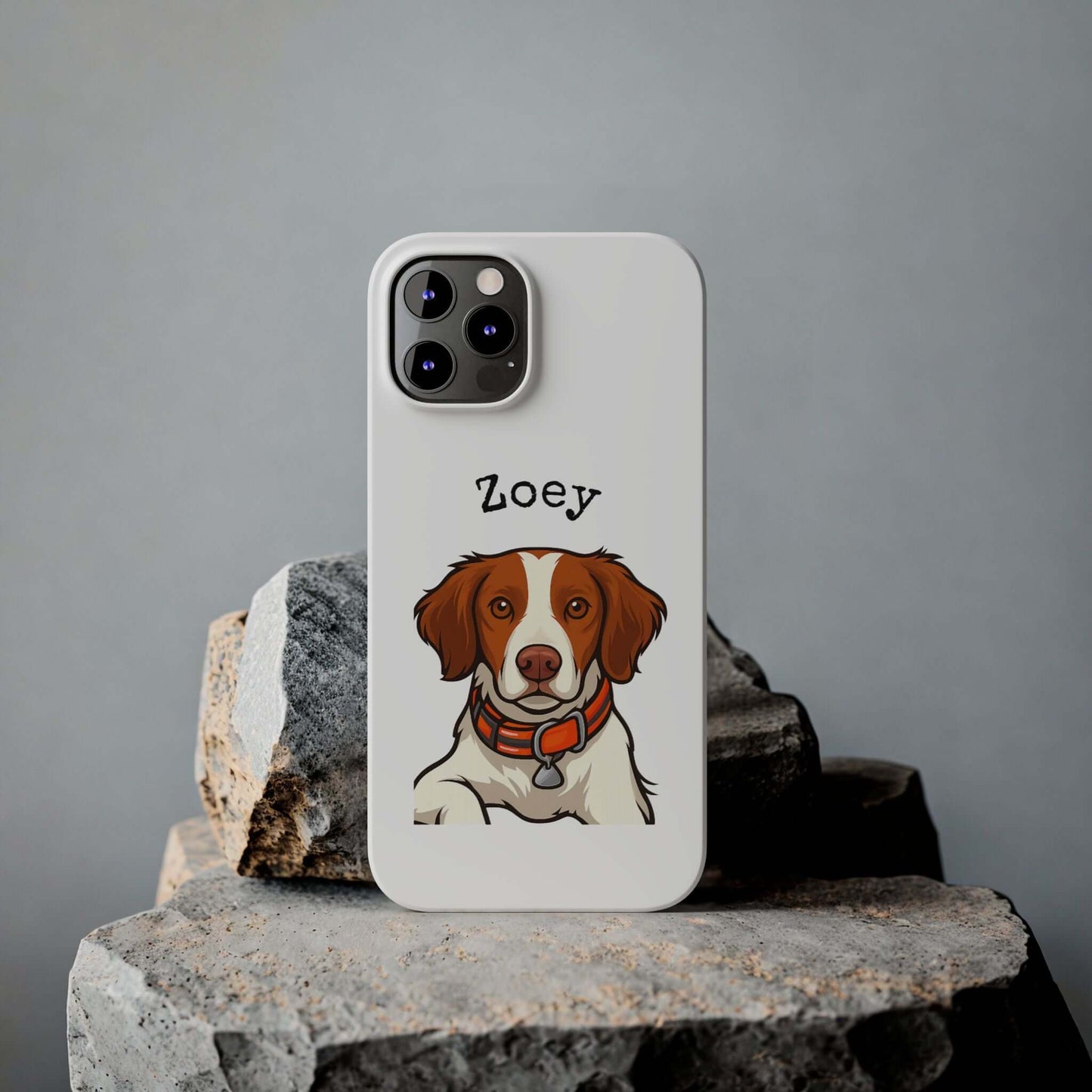 Custom cartoon phone case featuring a dog portrait named Zoey on a stylish white background.