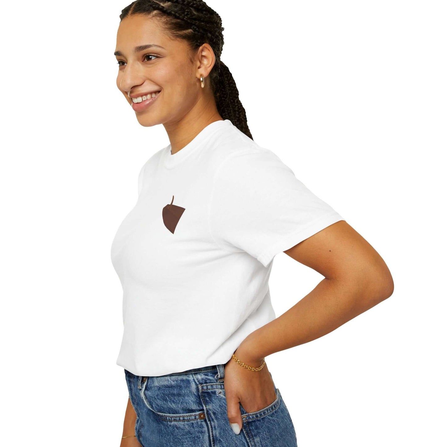 Smiling woman wearing a white t-shirt with a brown acorn logo, showcasing casual style and comfort.