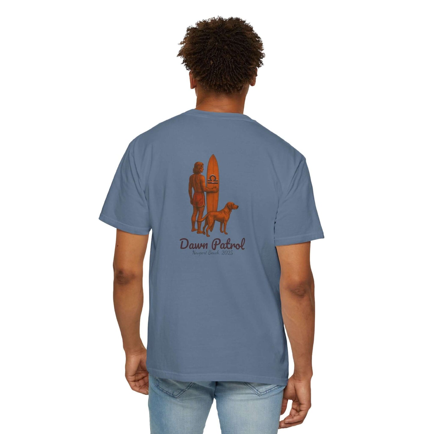 Back view of a blue personalized t-shirt featuring a surfer and dog with 'Dawn Patrol' text.