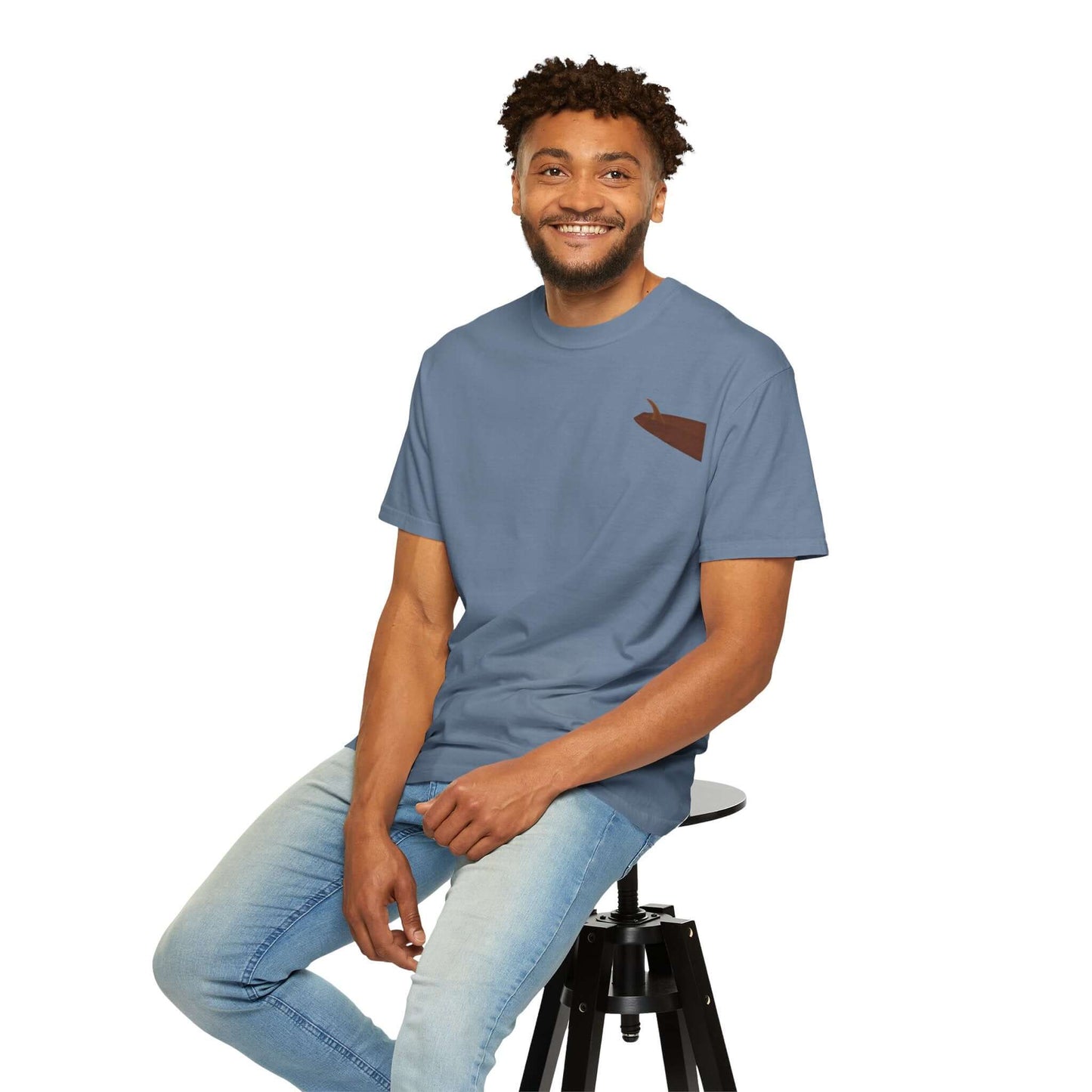 Smiling man wearing a personalized surf-inspired t-shirt in blue, showcasing a laid-back summer style.