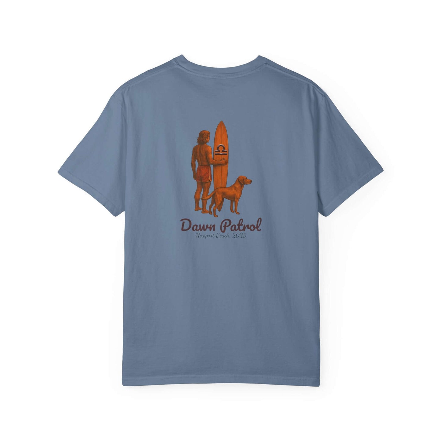 Back view of a blue t-shirt featuring a surfer, dog, and the text 'Dawn Patrol', perfect for beach lovers.