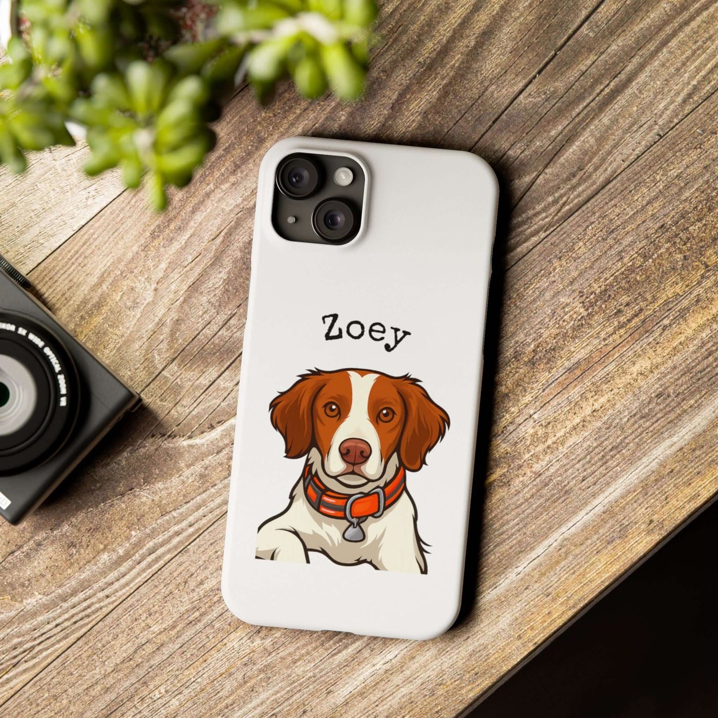 Custom cartoon phone case featuring a dog named Zoey on a wooden table, perfect for dog lovers.