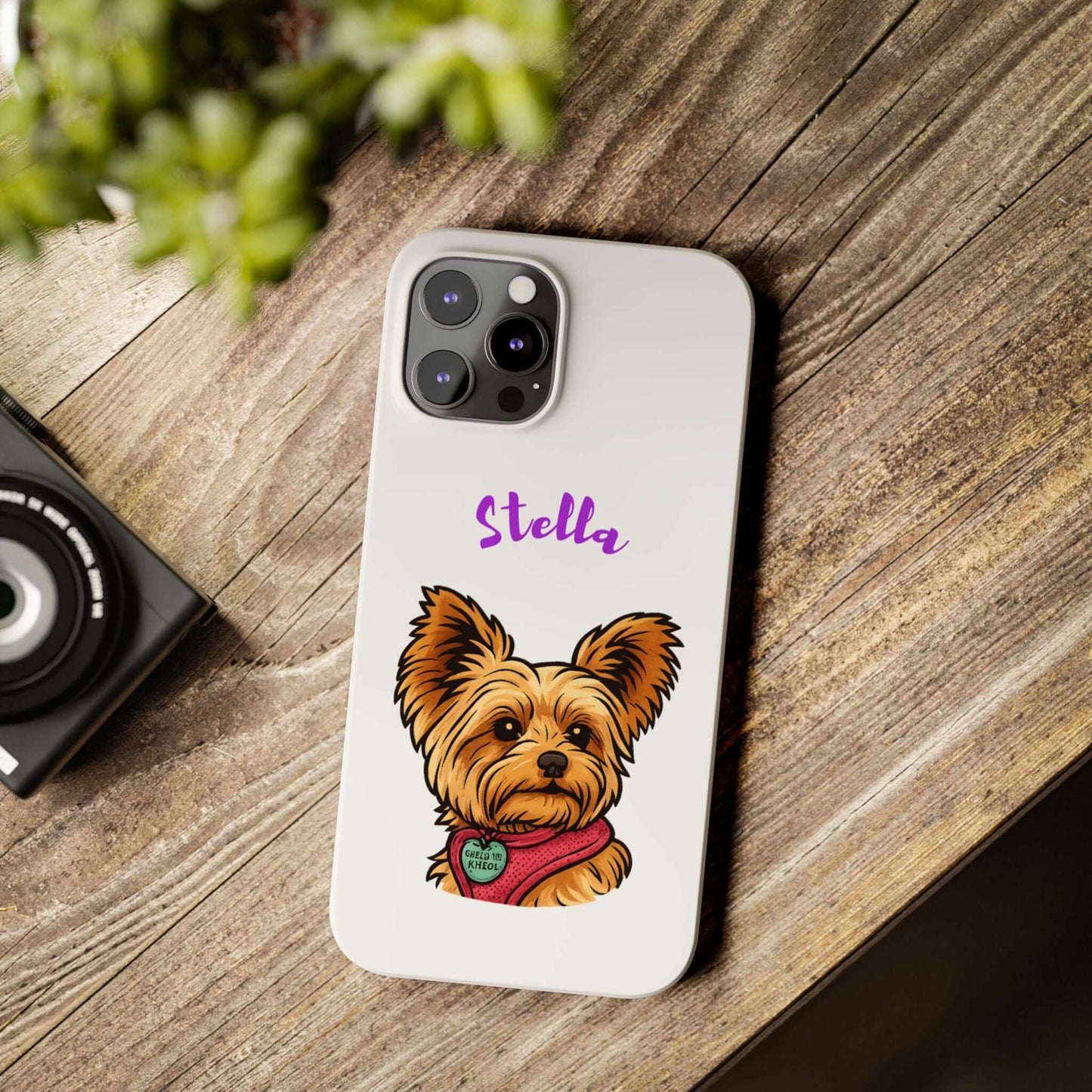 Custom cartoon phone case featuring a cute dog portrait named Stella on a wooden table.