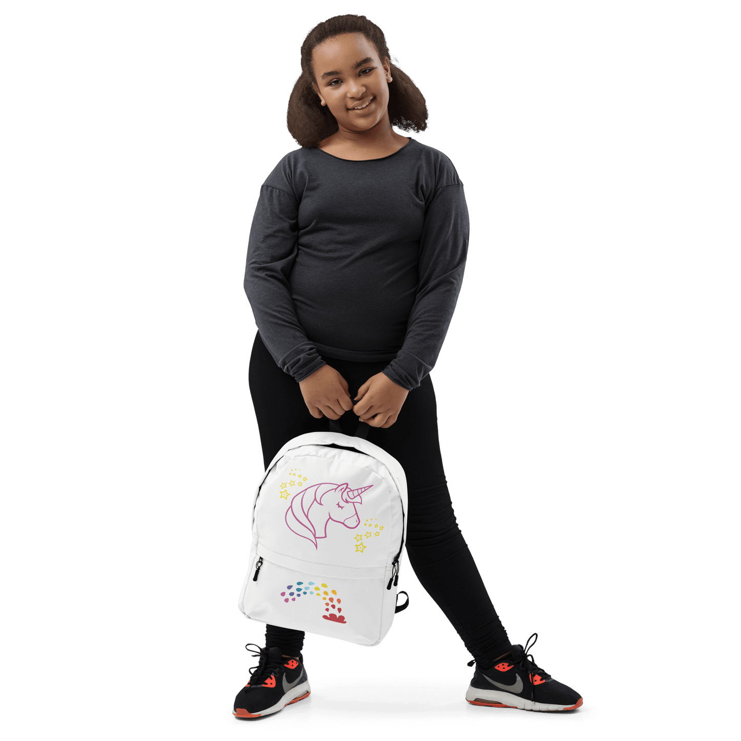Child in black outfit holding Unicorn Dreams Backpack with whimsical unicorn design.