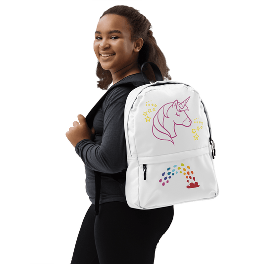 Girl wearing Unicorn Dreams Backpack featuring whimsical unicorn and rainbow design, perfect for school and adventures.