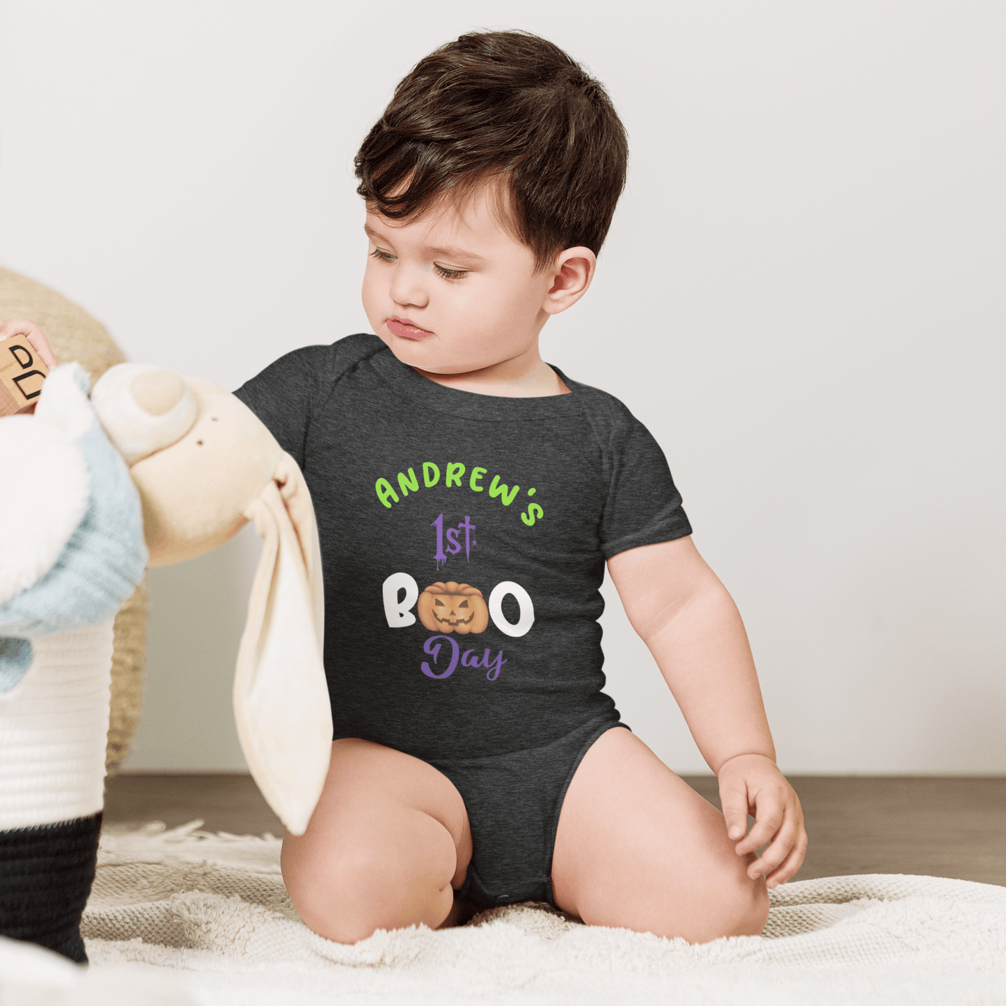 Personalized baby bodysuit with 'Andrew's 1st BOO Day' text, perfect for Halloween celebrations.