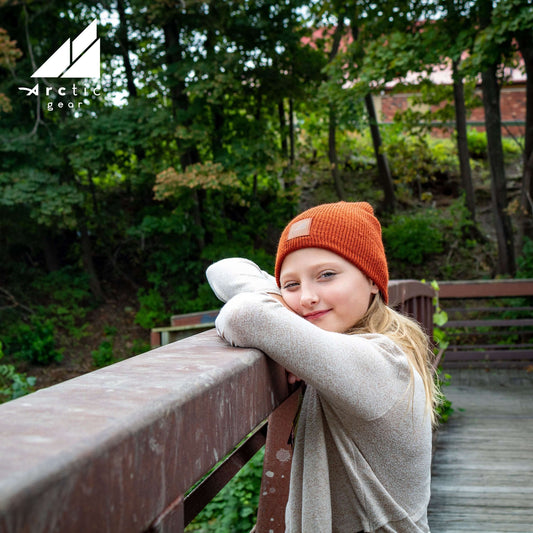 Child Acrylic Wool Beanie – Soft Winter Hat for Kids worn by a girl outdoors, showcasing warmth and style.