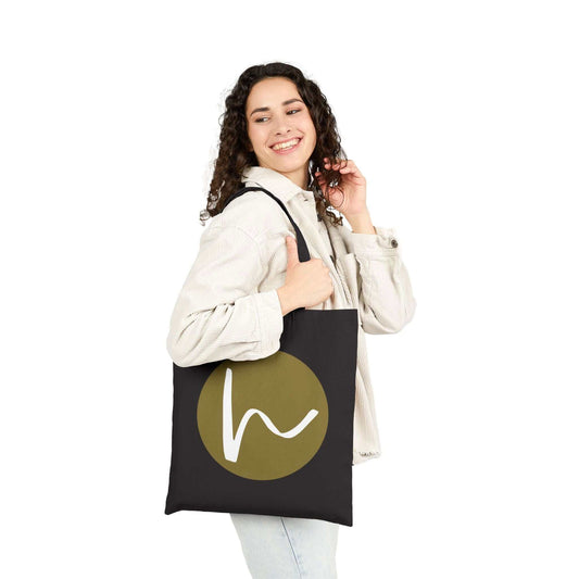Custom Cotton Canvas Tote Bag – Upload Your Own Design being carried by a smiling woman with a stylish logo.