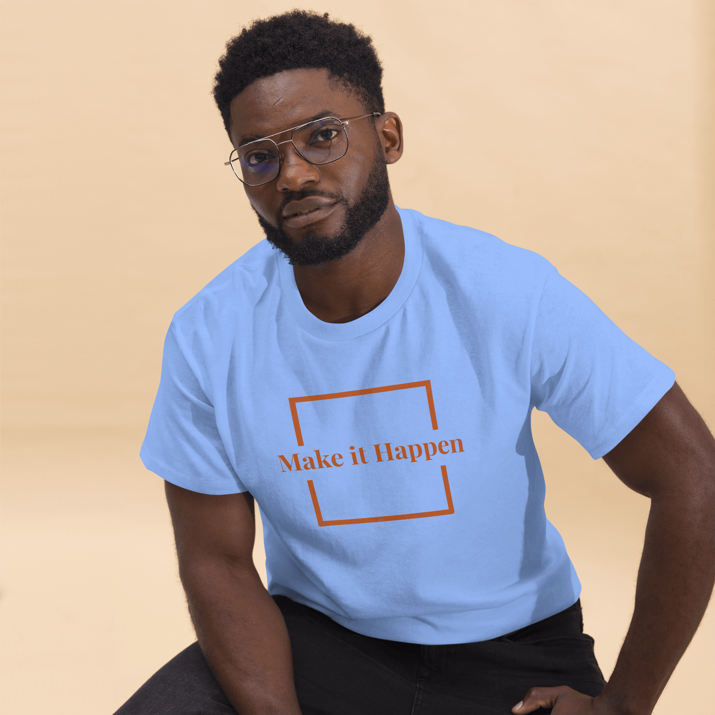 Freestyle Unisex T-Shirt β Upload Photos, Add Text & Emojis Your Way modeled by a man in a blue shirt with 'Make it Happen' text.