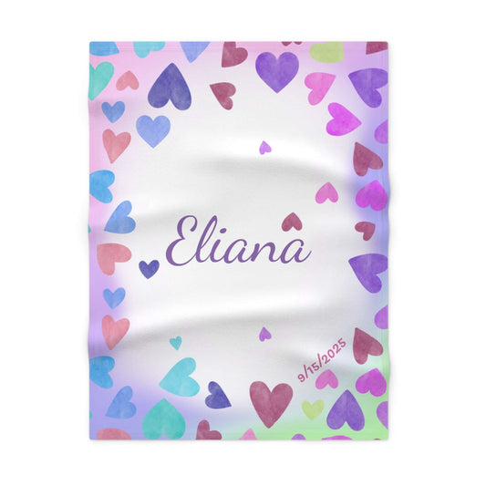 Personalized baby blanket with the name Eliana and heart-themed background in pastel colors.
