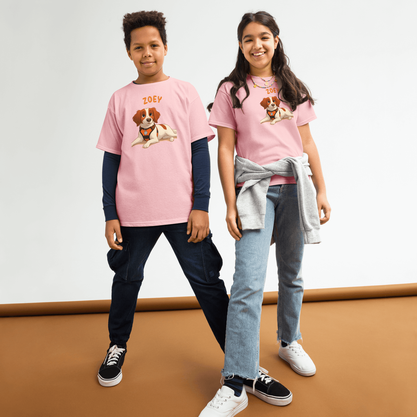 Kids wearing personalized cartoon pet shirts featuring a dog illustration and custom name 'Zoey' in playful style.