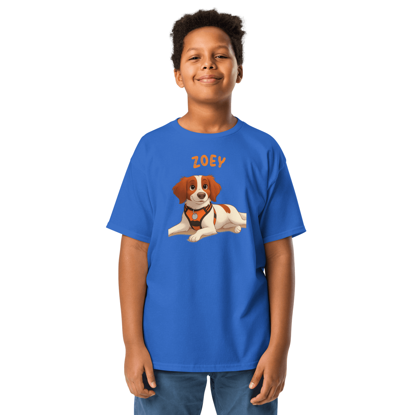 Boy wearing a blue personalized cartoon pet shirt featuring a dog illustration and the name 'Zoey'.