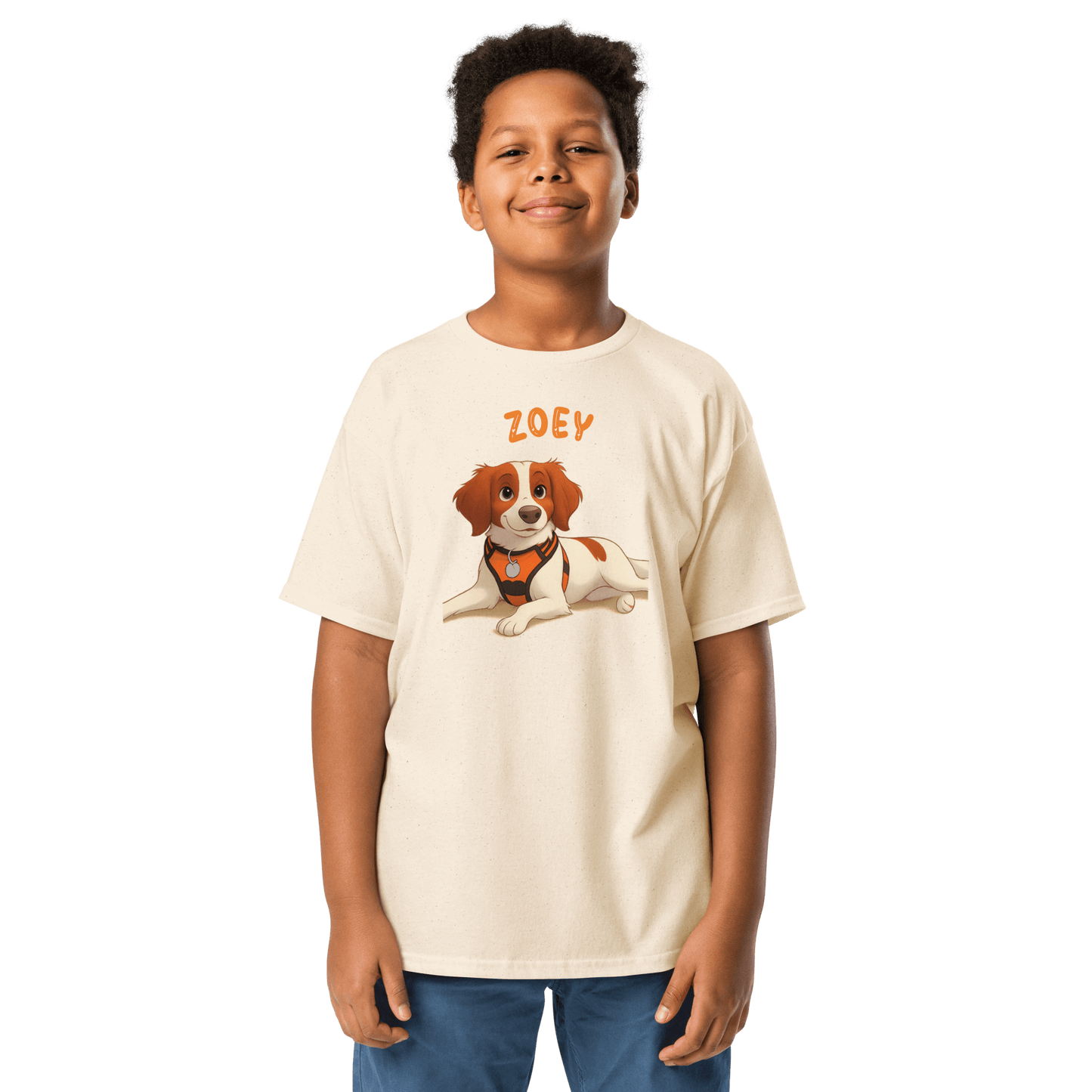 Smiling boy wearing a personalized cartoon pet shirt featuring a dog illustration and custom name 'Zoey'.