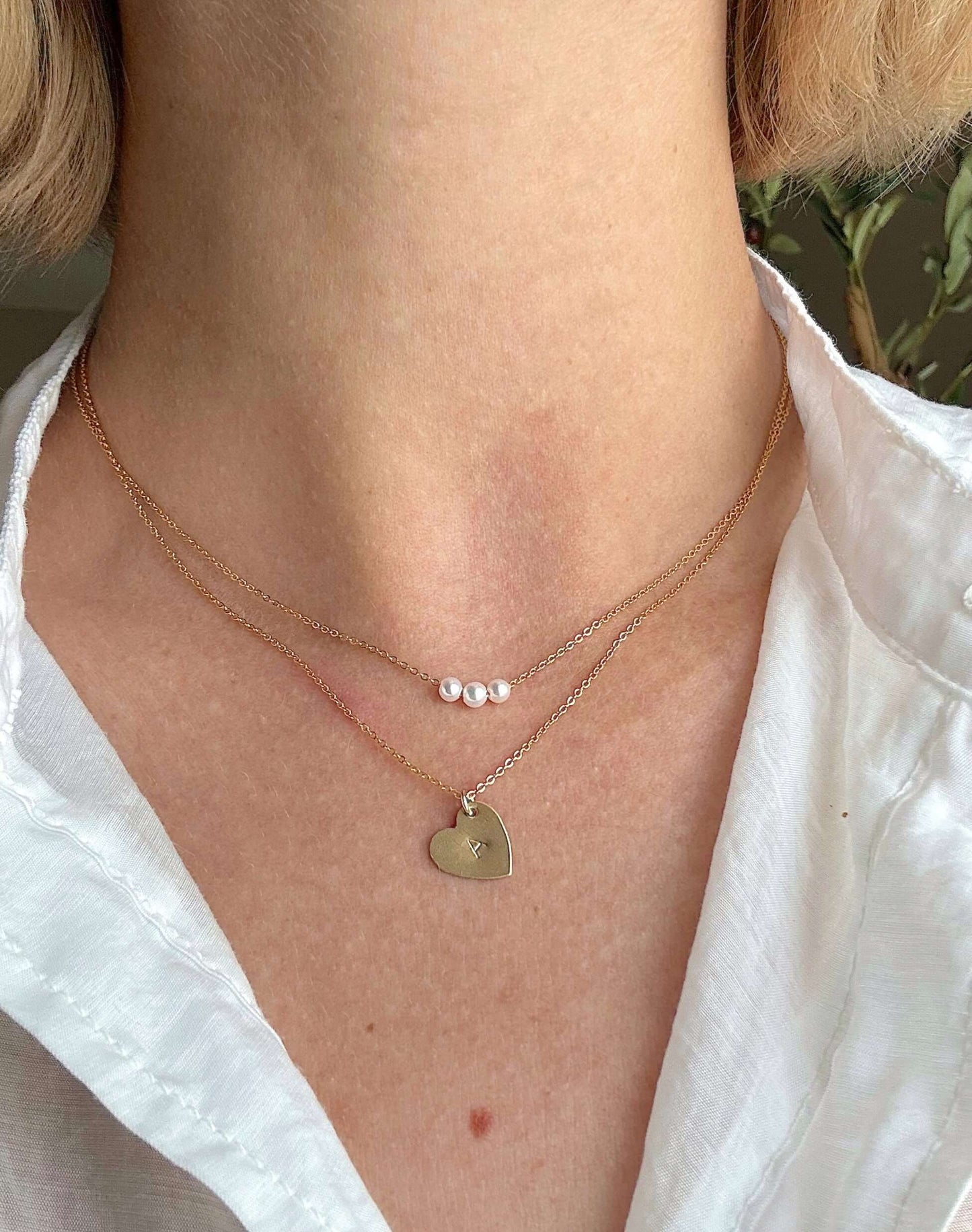 The First Layer – Personalized Sophia Initial Necklace in 14k Gold-Filled worn with a delicate pearl necklace.