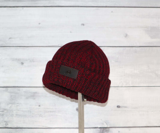 Toddler Acrylic Ribbed Cuff Hat – Soft, Stretchy & Made to Give in burgundy on a wooden background.