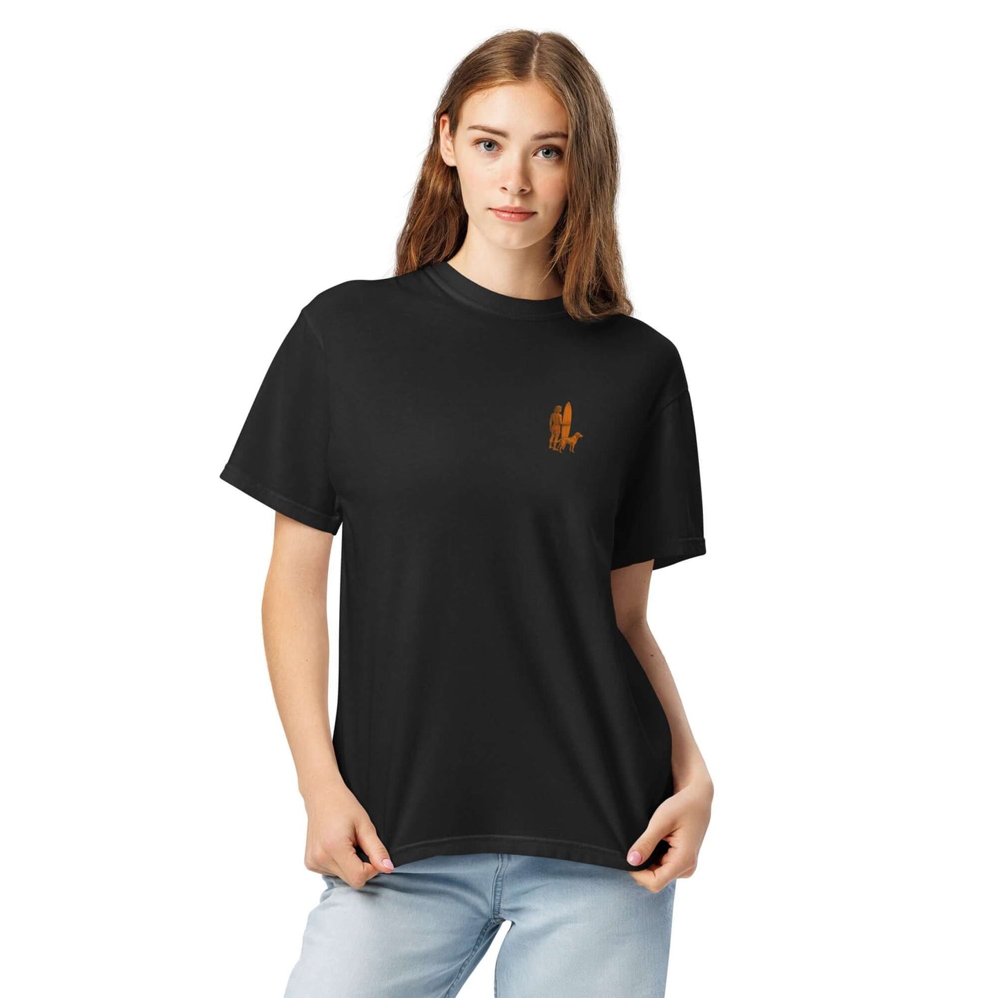 Black heavyweight tee featuring a minimalist surfer-and-dog design, perfect for beach adventures and sunset vibes.