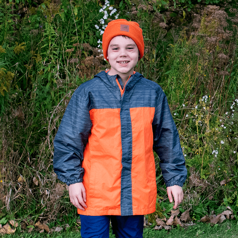 Child wearing an orange and gray jacket with an Adult Wool Watch Cap – Military Grade Winter Beanie outdoors.