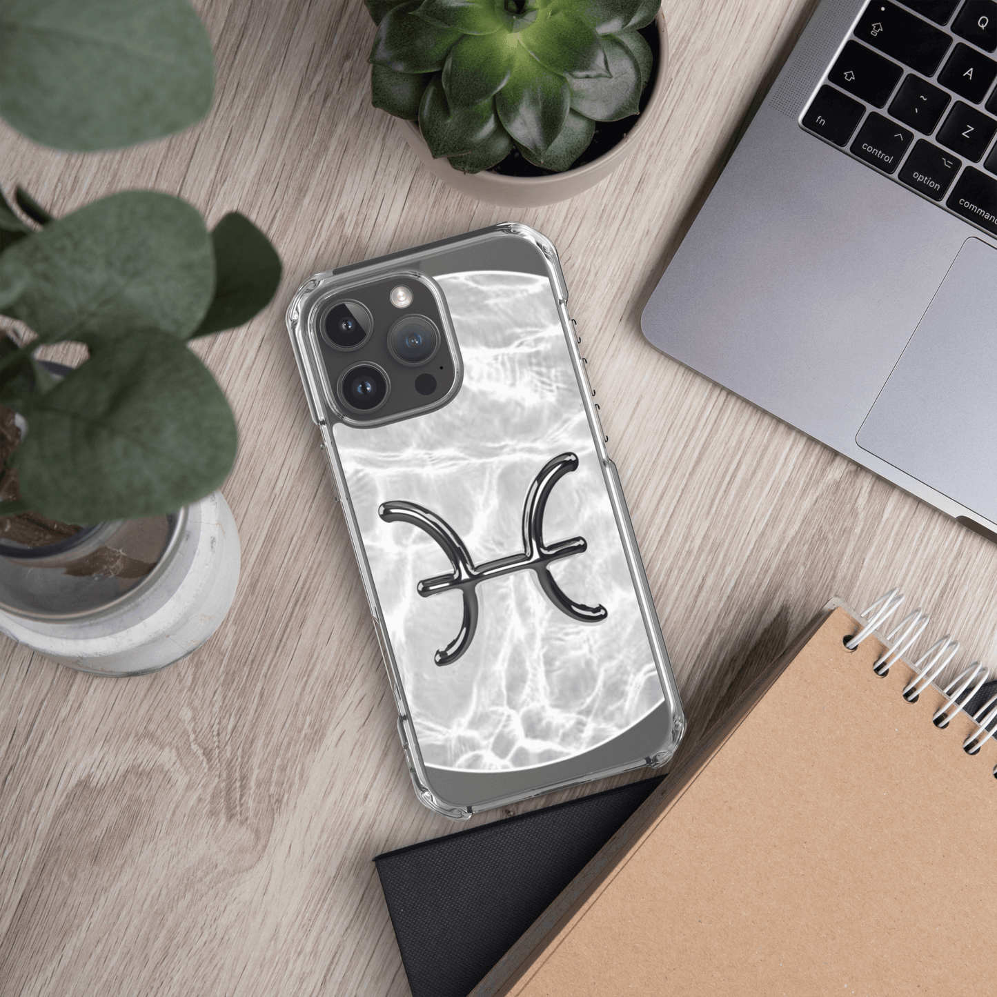 Zodiac Pisces Magsafe iPhone case with marble design, showcasing cosmic style and durability on a workspace.