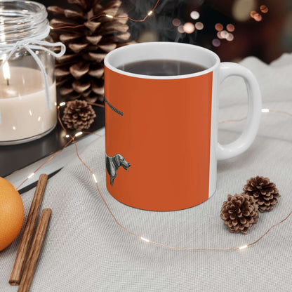 Personalized orange hunting mug with dog's silhouette, perfect for outdoor enthusiasts and coffee lovers.