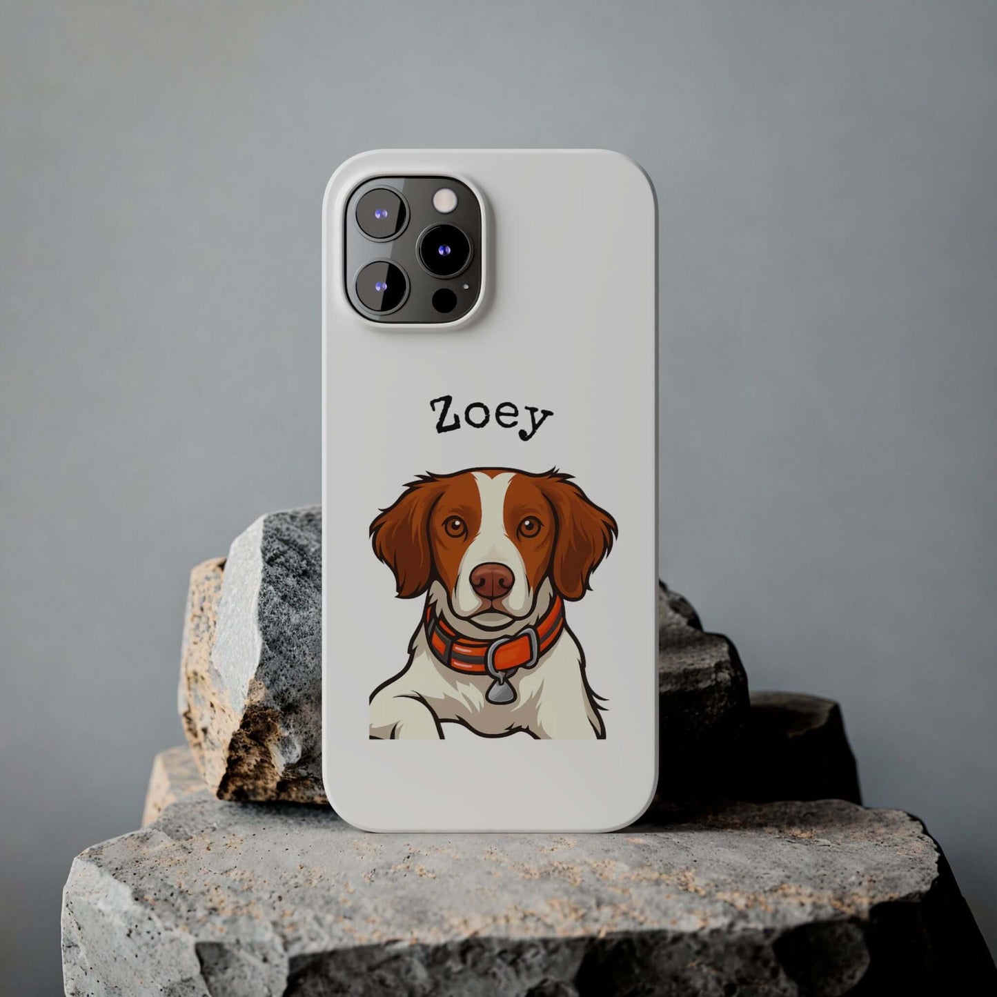 Custom cartoon dog phone case featuring a stylish illustration of a dog named Zoey on a sleek white background.