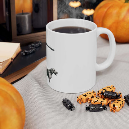 Personalized hunting mug with dog design on table with pumpkins and spooky decorations.