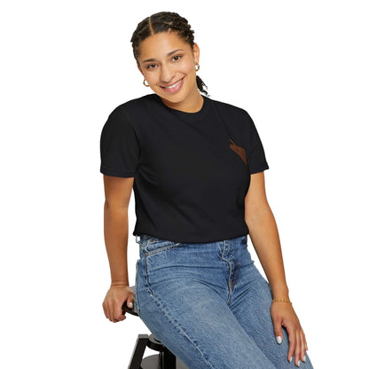 Smiling woman wearing a black personalized surf-themed t-shirt paired with high-waisted jeans, embodying summer vibes.