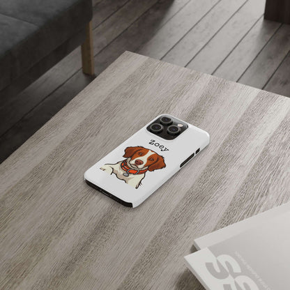 Custom dog cartoon phone case featuring a playful illustration of a dog named Zoey on a wooden table.