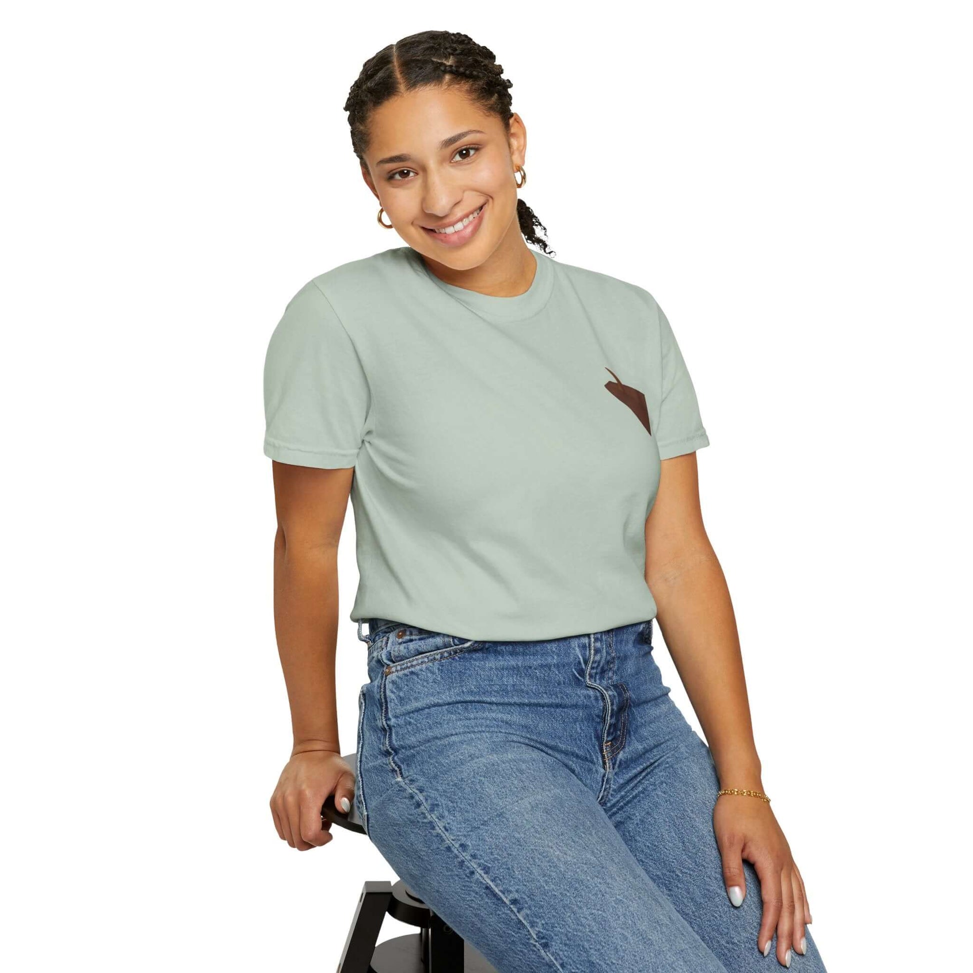 Woman smiling in personalized surf-inspired t-shirt, featuring a beachy design and casual style.