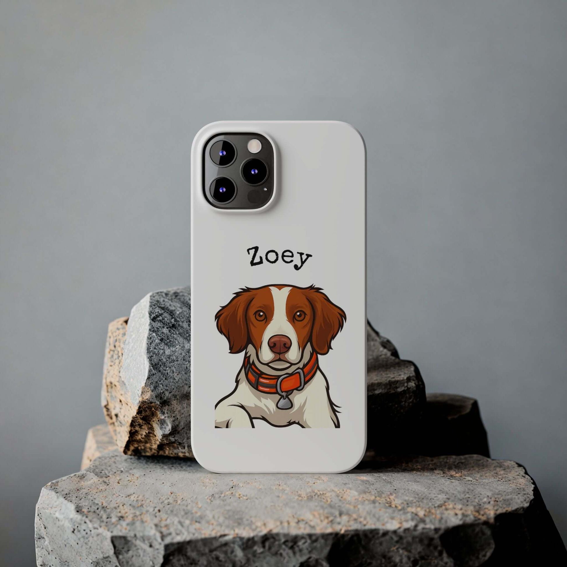 Custom cartoon phone case featuring a dog portrait named Zoey on a stylish white background.