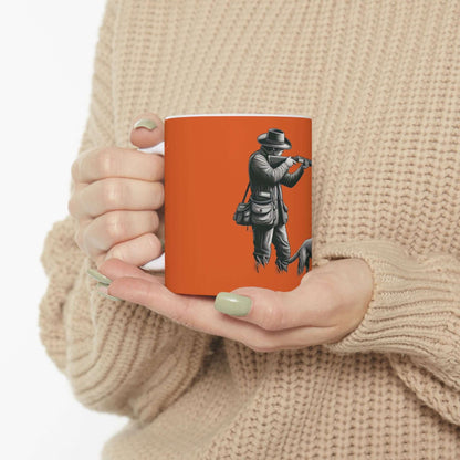 Personalized orange hunting mug featuring a hunter, perfect for outdoor enthusiasts and coffee lovers.