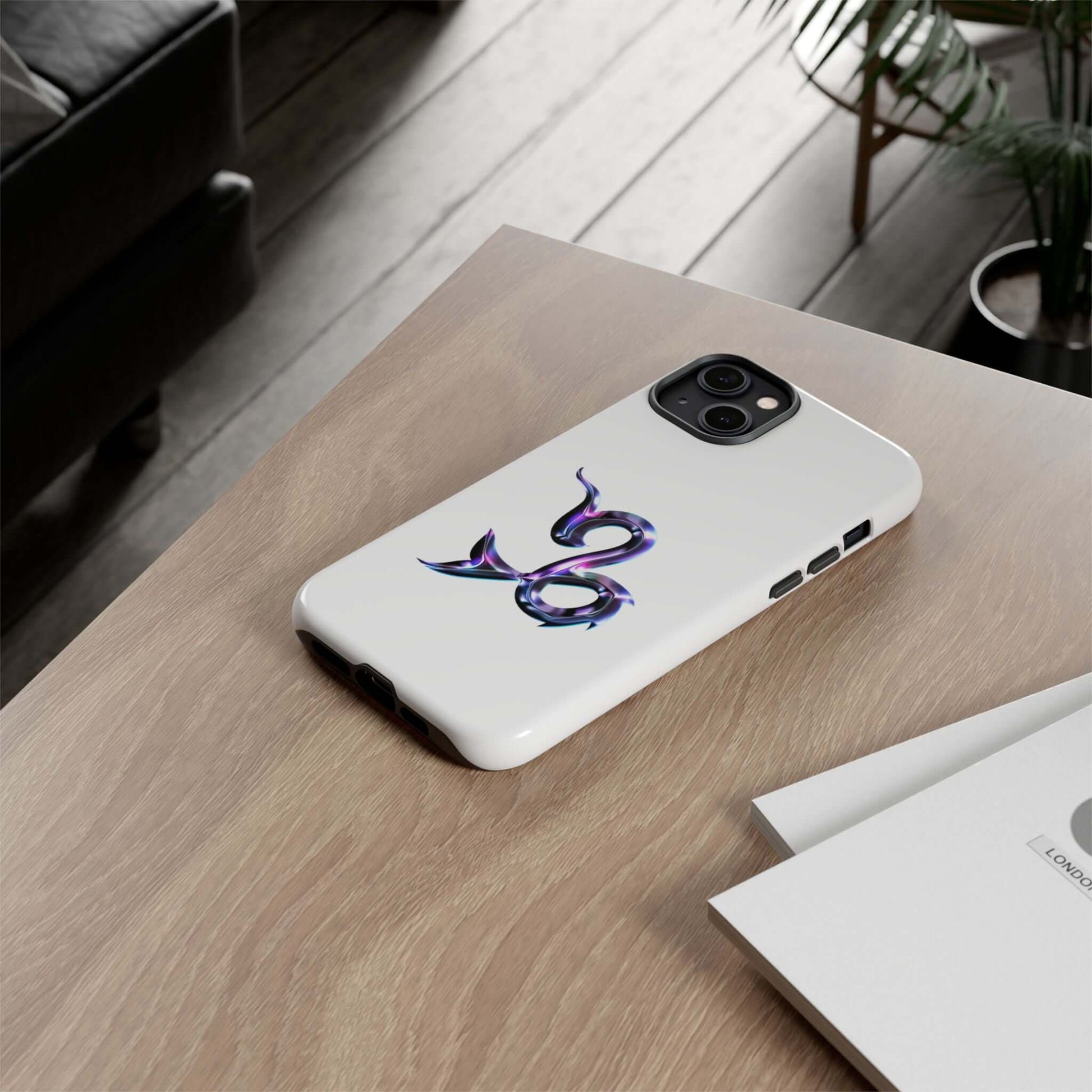 Personalized Zodiac phone case with vibrant snake design on a wooden table, perfect for astrology lovers.