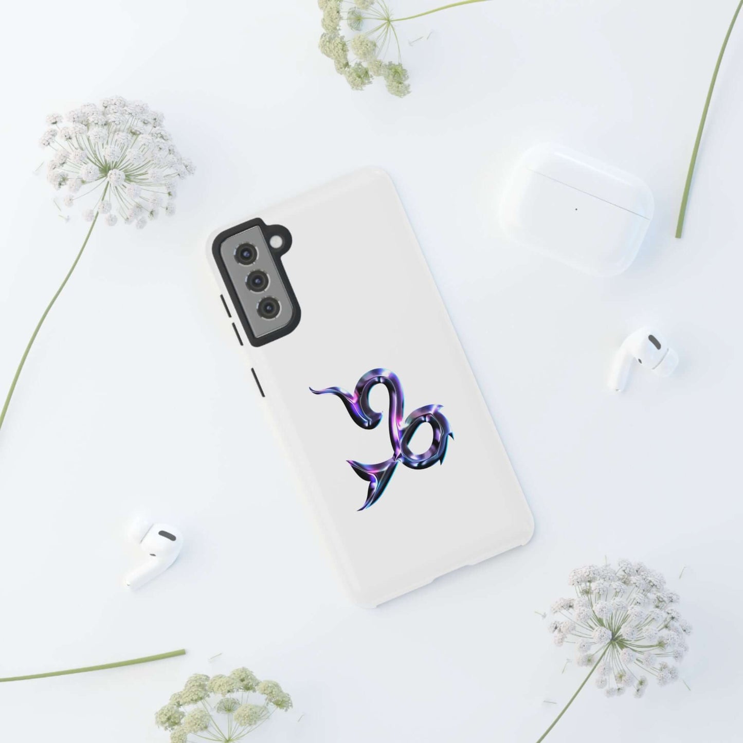 Personalized zodiac phone case with Capricorn design on a white background, surrounded by floral accents.