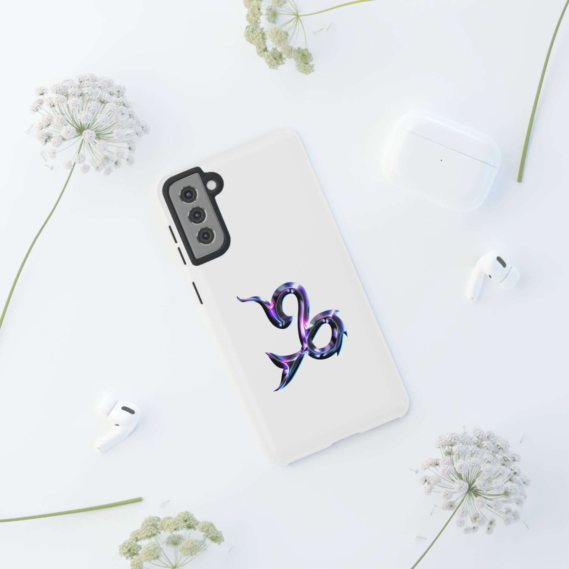 Personalized zodiac phone case with Capricorn design on a white background, surrounded by floral accents.