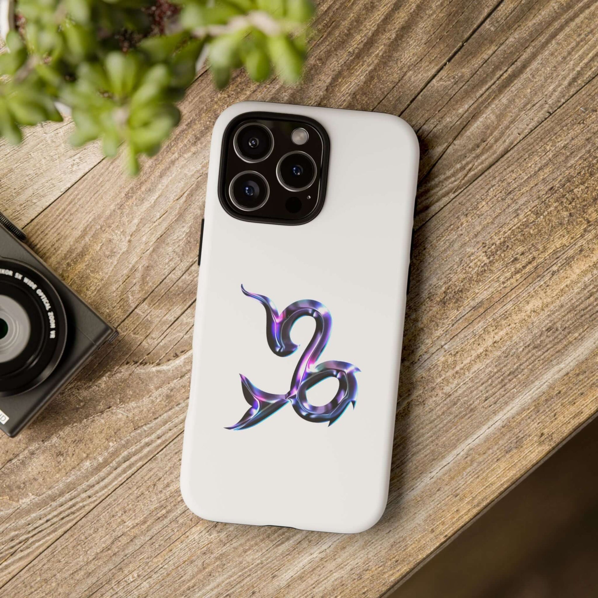 Stylish Capricorn zodiac phone case on a wooden surface, perfect for astrology lovers.