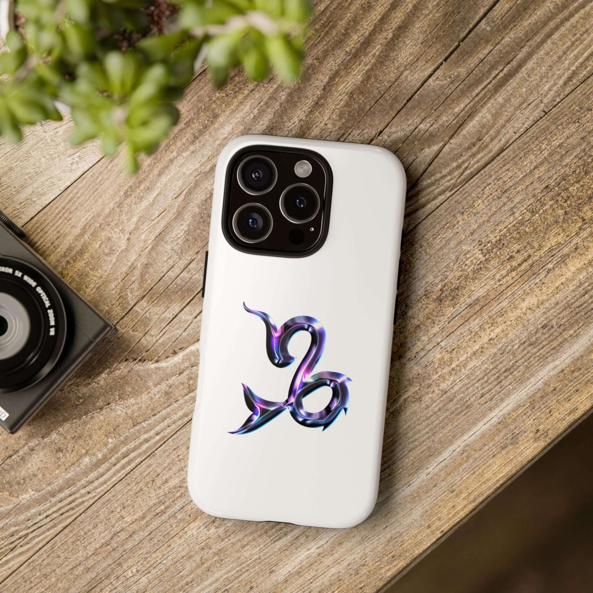 Zodiac phone case featuring a vibrant Capricorn design on a white background, stylishly protecting a phone.