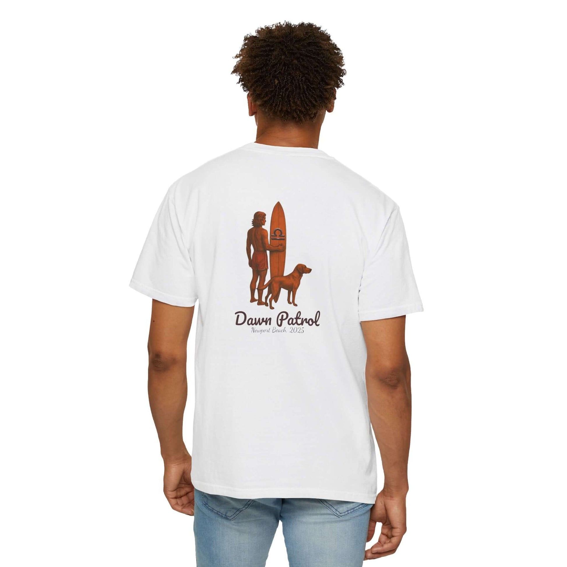 Back view of a white t-shirt featuring a surfer, dog, and 'Dawn Patrol' graphic design.