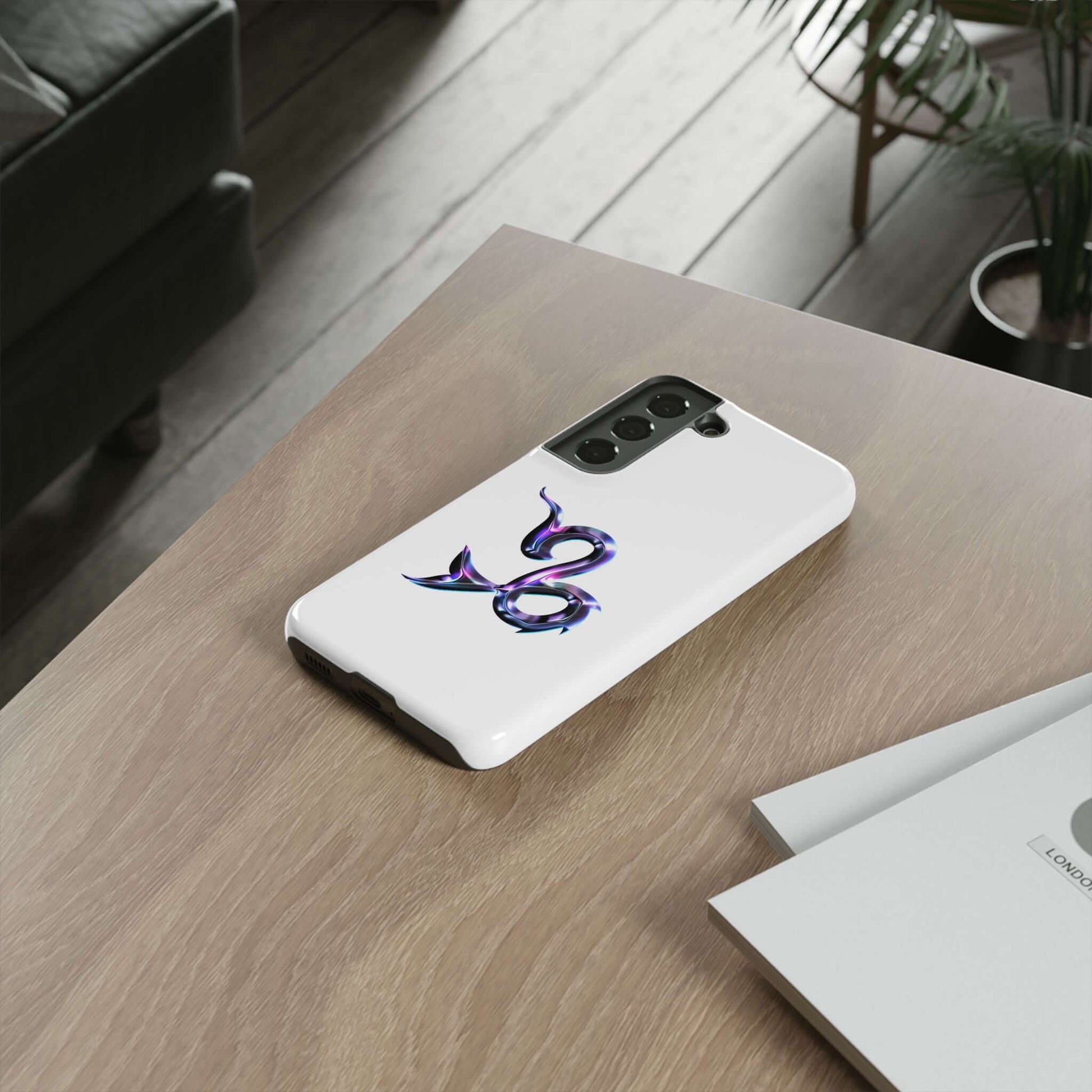 Personalized Zodiac phone case featuring vibrant purple design on a white background, displayed on a wooden table.