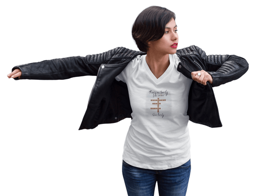 Woman in a v-neck customizable family quote t-shirt, wearing a black leather jacket, expressing joy.