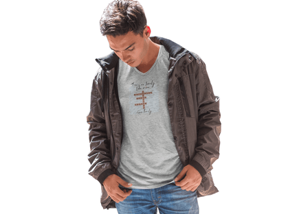 Young man wearing a customizable family quote t-shirt with v-neck and jacket outdoors.
