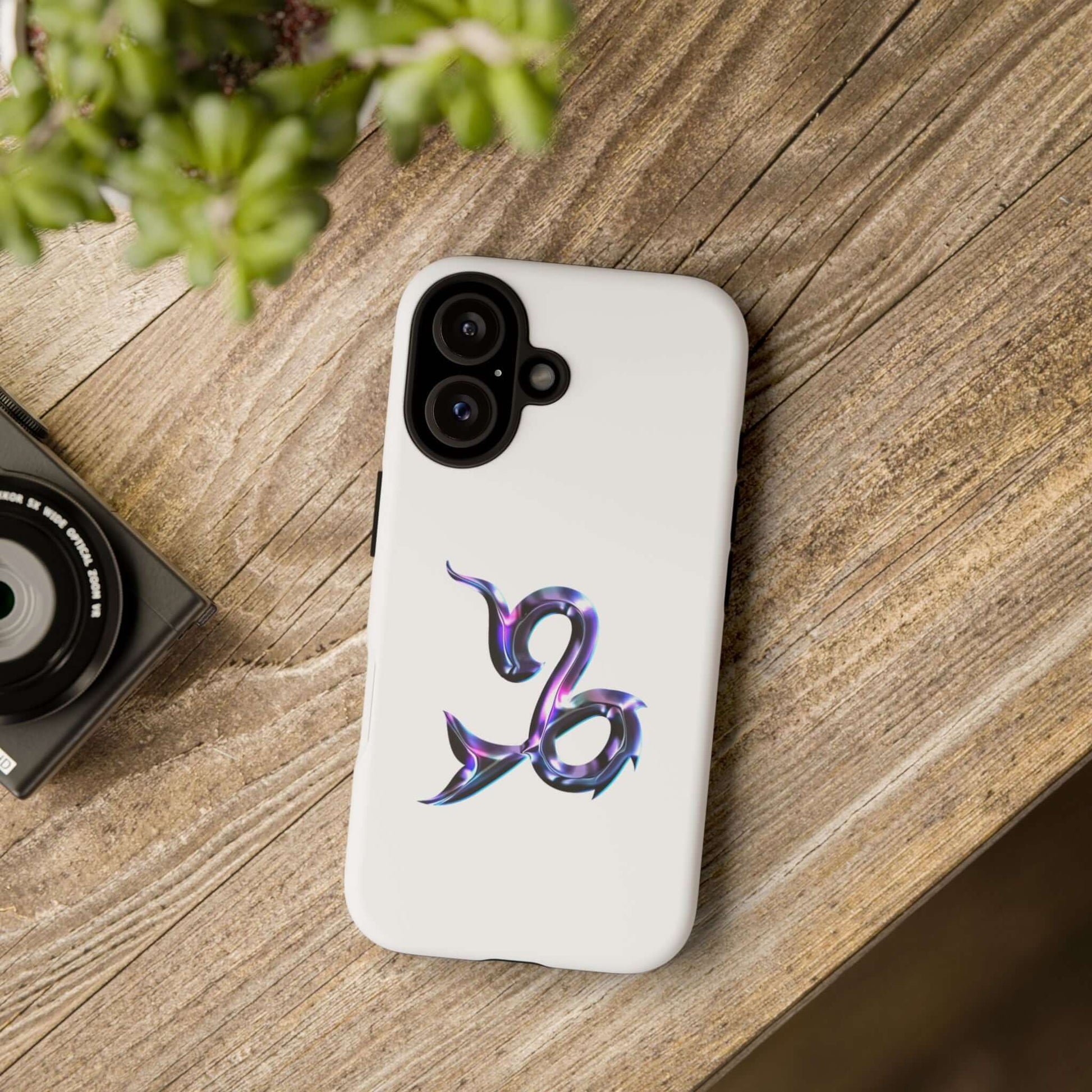 Personalized zodiac phone case featuring a colorful Capricorn design on a white background.