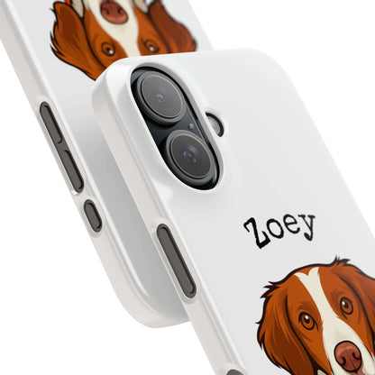 Personalized cartoon dog phone case featuring a brown and white dog illustration with the name Zoey.