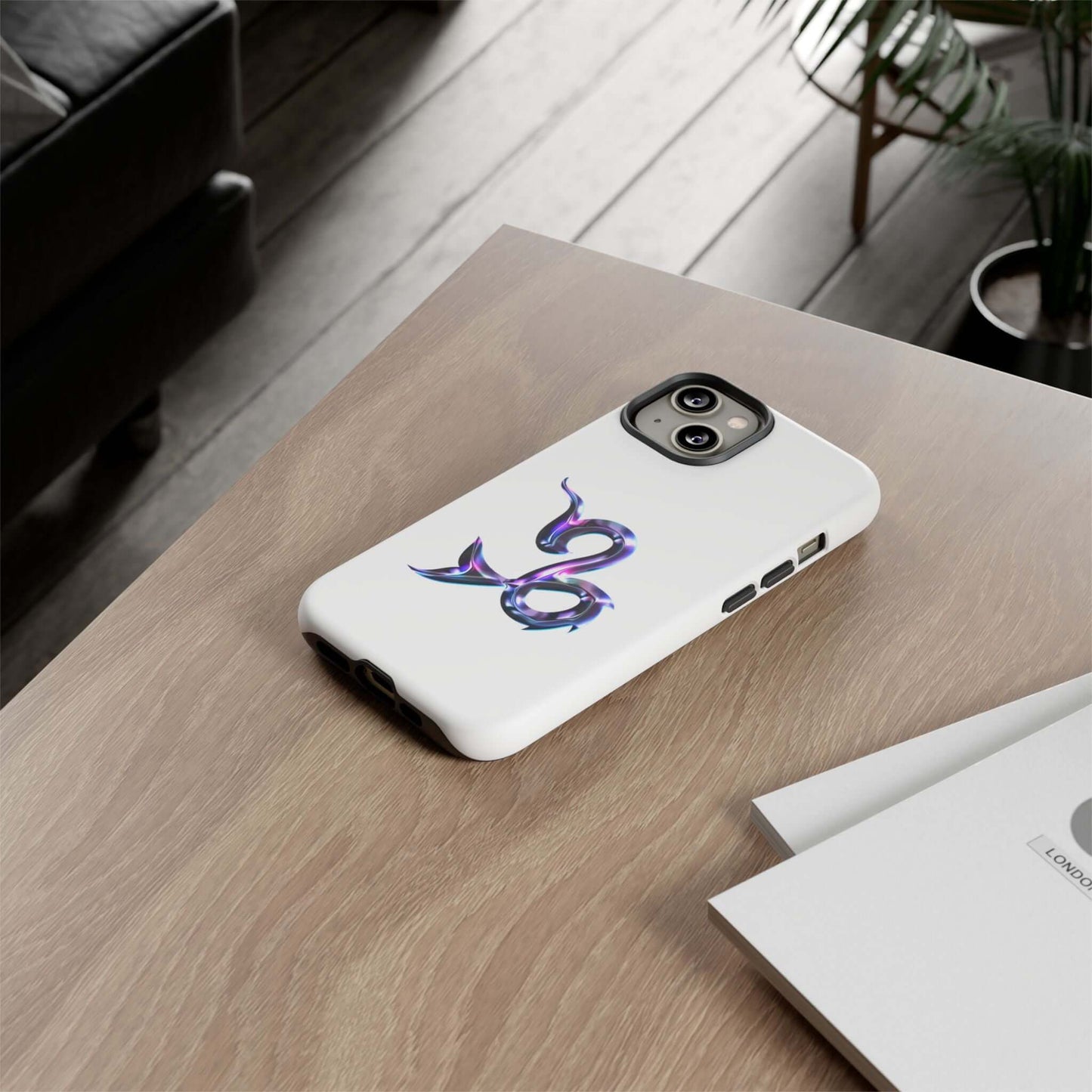 Personalized Zodiac phone case with colorful design on a wooden table, ideal for astrology lovers.