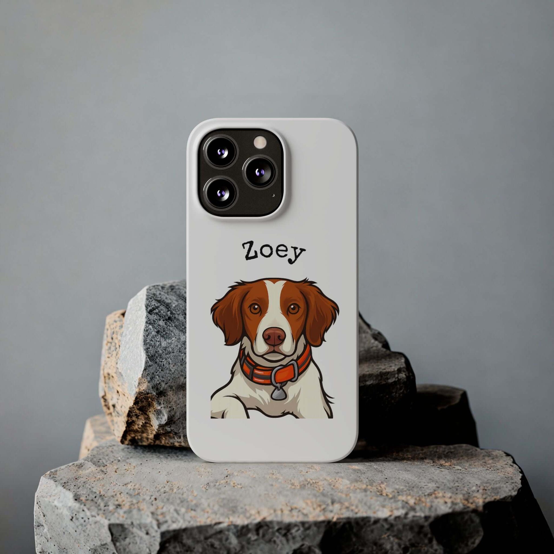 Custom dog phone case featuring cartoon illustration of a dog named Zoey on a stylish white background.