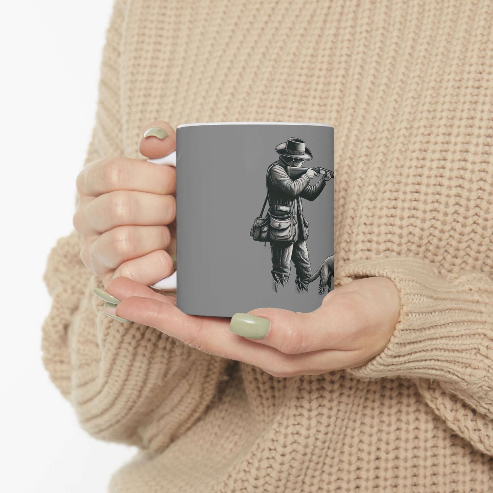 Personalized gray hunting mug held in hands, featuring outdoor enthusiast design, perfect gift for hunters.