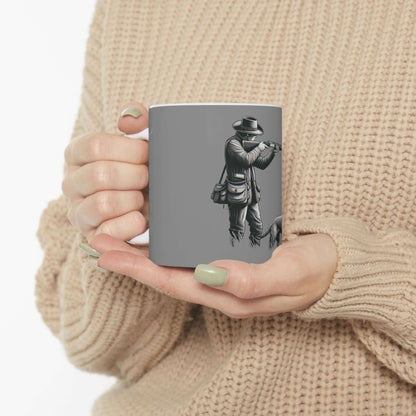 Personalized gray hunting mug held in hands, featuring outdoor enthusiast design, perfect gift for hunters.