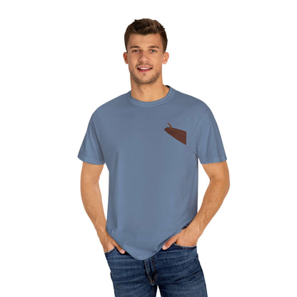 Man wearing a personalized surf-inspired t-shirt in blue, showcasing a fun and casual summer vibe.